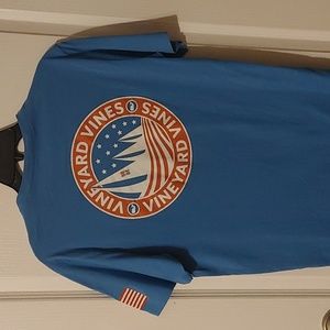 Vineyard Vines Blue T with Sailboat on pocket and back; American flag on sleeve